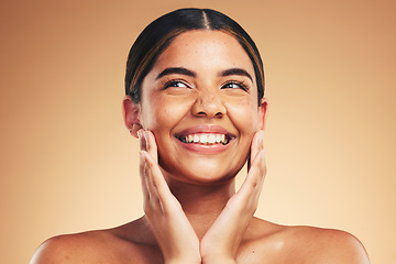 Image showing Skincare, happy and hands on natural woman face in studio for cosmetic, wellness or dermatology on brown background. Beauty, smile and model excited for glowing skin, results or self love cosmetology