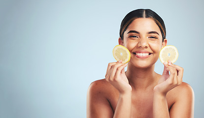 Image showing Lemon, skincare and woman portrait in studio for vitamin C, wellness or organic, beauty or detox on grey background, Fruit, face and model smile for citrus facial, collagen or anti aging dermatology