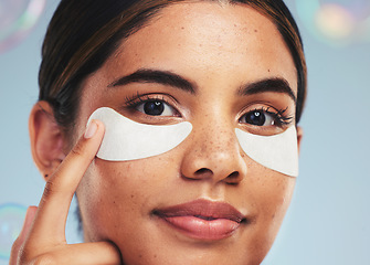 Image showing Eye patch, portrait and face of woman for beauty, dermatology and aesthetic skincare on studio background with bubbles. Model, self care and cosmetics for eyes, facial collagen and anti aging product