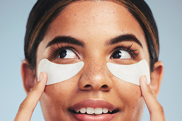 Image showing Eye patch, face and woman with beauty cosmetics, dermatology and aesthetic skincare on studio background. Closeup, model and thinking of cosmetology for eyes, facial collagen and anti aging product