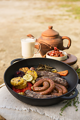 Image showing Grilled sausages with vegetables