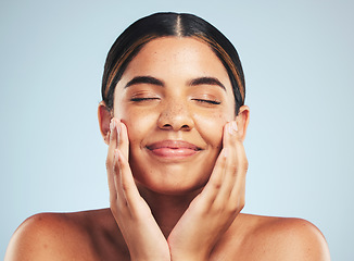 Image showing Skincare, wellness and hand on face of woman in studio for cosmetology, cleaning and results on grey background. Happy, beauty and female model with cosmetic, treatment and self love satisfaction