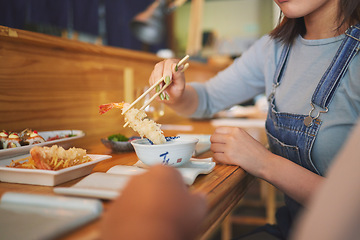 Image showing Hands, chopsticks and woman with shrimp in restaurant, fine dining and eating in cafe store. Sushi, sticks and person on prawn, tempura food and fish meat in bowl for lunch, brunch and seafood meal