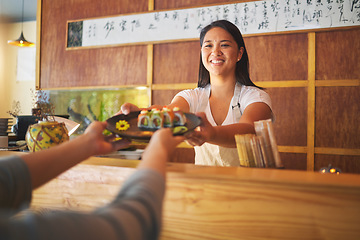 Image showing Sushi chef, restaurant worker and woman with smile from food and Asian meal in a kitchen. Happy, female waiter or job working with fish menu for lunch order with cooking in Japanese bar with service