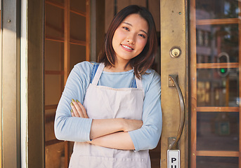 Image showing Portrait, waitress and Asian woman with arms crossed at door of restaurant, coffee shop or store. Face, smile and confident barista, happy employee or small business entrepreneur at cafe in Japan