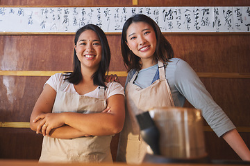 Image showing Restaurant, portrait and asian women at counter together with smile, confidence and opportunity at small business. Teamwork, happiness and startup cafe owner with waitress in Japanese food store.