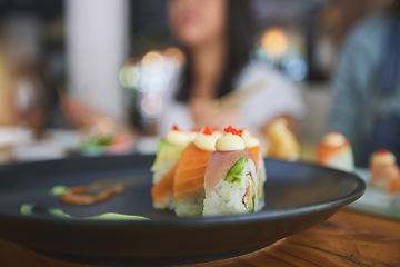 Image showing Restaurant, food and closeup of sushi on a plate for luxury, healthy and authentic Asian cuisine. Platter, fine dining and zoom of a Japanese meal for lunch, dinner or supper at a traditional cafe.