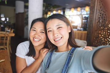 Image showing Selfie, love and an LGBT couple in a restaurant for a romantic date together on their anniversary. Portrait, smile and a happy asian woman with her lesbian partner in a cafe for a celebration