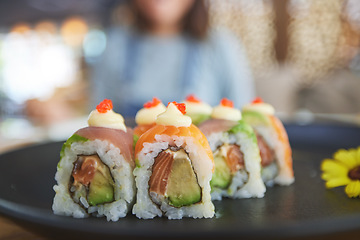 Image showing Closeup, restaurant plate and sushi for lunch, eating seafood and Chinese food on bokeh. Zoom, health and a hungry person with a luxury fine dining dish of fish, Asian cuisine and dinner at a cafe