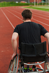 Image showing A person with disability in a wheelchair training tirelessly on the track in preparation for the Paralympic Games