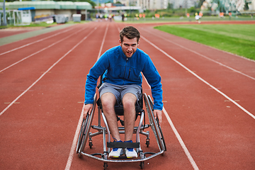 Image showing A person with disability in a wheelchair training tirelessly on the track in preparation for the Paralympic Games