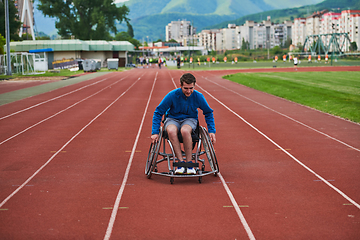 Image showing A person with disability in a wheelchair training tirelessly on the track in preparation for the Paralympic Games