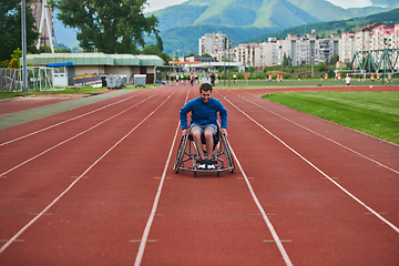 Image showing A person with disability in a wheelchair training tirelessly on the track in preparation for the Paralympic Games
