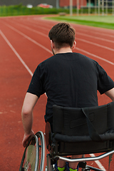 Image showing A person with disability in a wheelchair training tirelessly on the track in preparation for the Paralympic Games