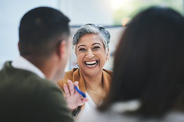 Image showing Team, happy woman or business people in meeting laughing at funny joke in discussion or collaboration together. Smile, leadership or excited mature mentor talking or speaking of ideas to employees