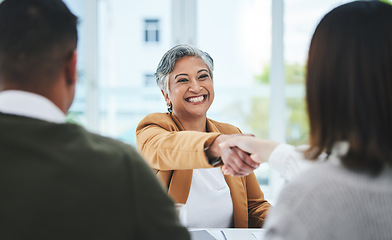 Image showing Handshake, job interview or business people with a happy mature woman for partnership in office. We are hiring, smile or business people shaking hands for success, promotion or negotiation in meeting