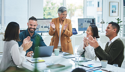 Image showing Happy business people in meeting at desk with applause, cheers and celebration of sales target achievement. Clapping, praise and congratulations with success, motivation for men and women in office.