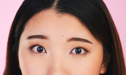 Image showing Closeup, eyes and portrait of an Asian woman on a pink background for makeup or microblading. Face, skincare and a girl or model isolated on a backdrop for facial cosmetics, foundation or eyeliner