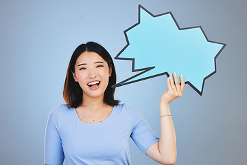 Image showing Speech bubble, woman voice and student presentation, chat or communication for college opportunity or forum. Portrait of asian person with opinion, feedback or mockup poster on blue studio background