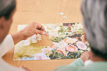 Image showing Puzzle on table, entertainment and senior couple in home for bonding, fun activity and relax together. Retirement, marriage and above of man and woman with jigsaw for playing games, hobby and connect