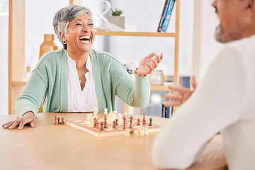 Image showing Laughing, game and senior couple with chess in a house in retirement for a competition. Happy, together and a funny and elderly man and woman with a board for a challenge or bonding with conversation