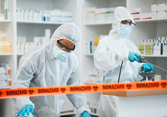 Image showing Biohazard, chemical and cleaning with people in a pharmacy for decontamination after a medical accident. Hazmat, spray or disinfect with healthcare personnel in a drugstore to sanitize and isolate