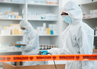 Image showing Biohazard, chemical and disinfect with people in a pharmacy for decontamination after a medical accident. Hazmat, spray or cleaning with healthcare personnel in a drugstore to sanitize and isolate