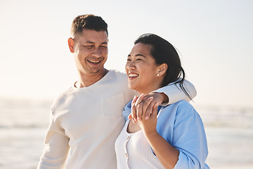 Image showing Love, smile and hug with couple at beach for travel, summer vacation and romance together. Happy, relax and bonding with man and woman walking on seaside holiday for care, date and honeymoon