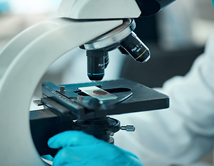 Image showing Microscope, medical science and blood sample in a laboratory for analysis, study or development. Zoom on equipment for research, future and gloves of scientist with virus, particle or dna test