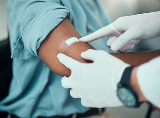 Image showing Plaster on arm, vaccine and wound, hands of doctor with patient and health, medicine and medical procedure. Bandage, injury and injection with people at hospital, healthcare and wellness with help