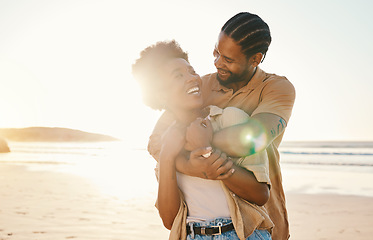 Image showing Beach, sunset and happy black couple hug, love and enjoy time together on Nigeria vacation, travel or romantic date. Marriage honeymoon, lens flare and relax African people embrace on anniversary