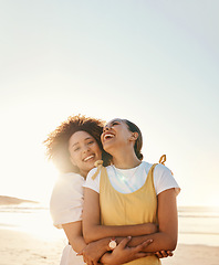 Image showing Portrait, laughing and gay couple hugging on the beach together for romance or bonding on a date. Mockup, sunset and an lgbt woman with her lesbian girlfriend by the sea or ocean for their honeymoon
