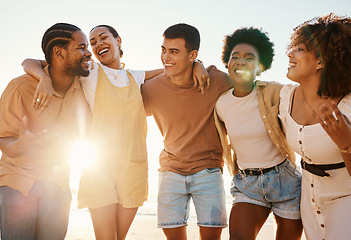 Image showing Summer, relax and hug with friends at beach for freedom, support and sunset. Wellness, energy and happy with group of people laughing by the sea for peace, adventure and Hawaii vacation together