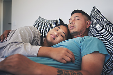 Image showing Couple, sleeping and hug together in bed to relax, rest and cuddle in marriage, relationship or love for partner in morning. Tired, man and woman dreaming with peace in home, house or bedroom