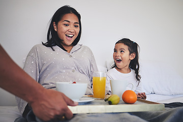 Image showing Surprise, breakfast and mother with child in bed relaxing on weekend morning at their home. Happy, smile and young mom enjoying healthy food for brunch meal with her daughter for mothers day in house