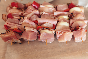 Image showing raw meat on skewers ready for grill