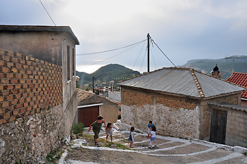 Image showing children playing narrow alley