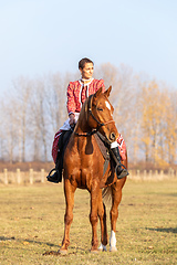 Image showing Hungarian csikos horsewoman in traditional folk costume