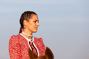 Image showing Hungarian csikos horsewoman in traditional folk costume