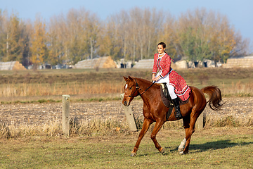 Image showing Hungarian csikos horsewoman in traditional folk costume