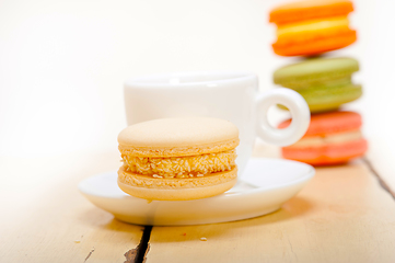 Image showing colorful macaroons with espresso coffee