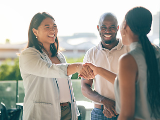 Image showing Business people, handshake and happy in collaboration, deal or agreement in city. Shaking hands, smile and group in b2b partnership, integration and success in negotiation for startup acquisition