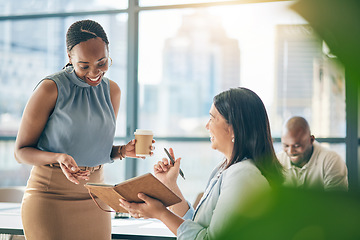 Image showing Teamwork, diversity and notebook with business woman planning their schedule or calendar in the office. Collaboration, agenda and a professional employee reading a journal or diary with her colleague