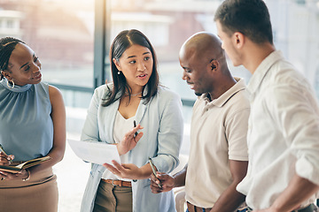 Image showing Meeting, business people with woman boss and paperwork for training, motivation and collaboration. Teamwork, men and women in office with documents, feedback and brainstorming at workshop with mentor