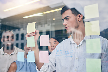 Image showing Window, collaboration and sticky note, brainstorming and man is writing, project management and strategy. Ideas, planning and business people with moodboard, workshop and goals with productivity