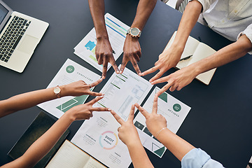 Image showing Star fingers, team and documents in office, group and peace sign with planning, startup and top view at desk. Business people, hands and synergy with link, icon and paperwork for growth in workplace