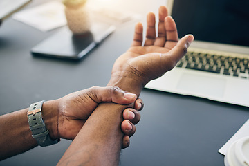 Image showing Closeup of a businessman with wrist injury, pain or accident in the office with carpal tunnel. Medical emergency, arthritis and male person with nerve, muscle or joint sprain in his arm in workplace.