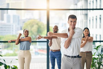 Image showing Workout, stretching and a group of business people in the office to exercise for health or mobility together. Fitness, wellness and coach training an employee team in the workplace for a warm up