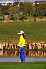 Image showing China golf caddie waiting