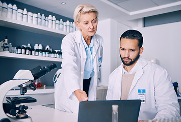 Image showing Scientist, mentor and training on computer for research, data analysis and laboratory report in pharmaceutical solution. Science or medical woman and man with teamwork and medicine support on laptop